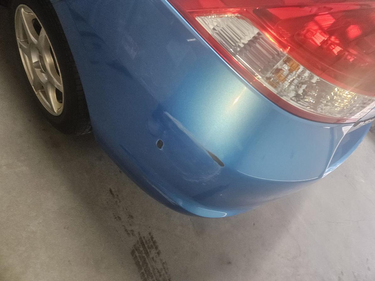 Rear bumper with dents and scratches
